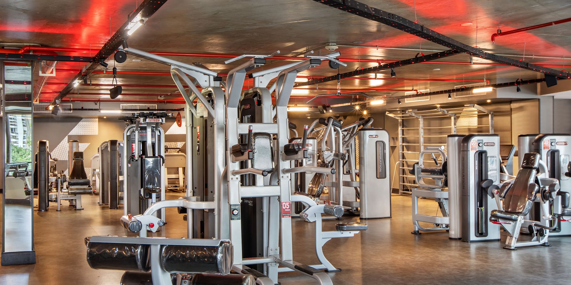 a gym with several exercise equipment