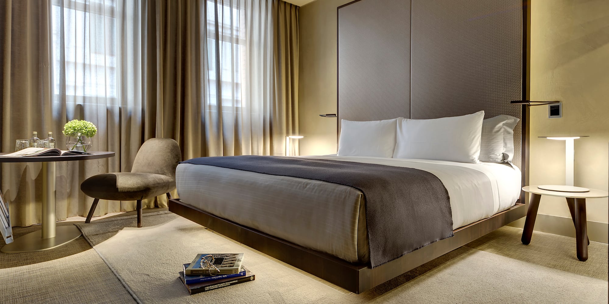 a bedroom with a bed and a chair