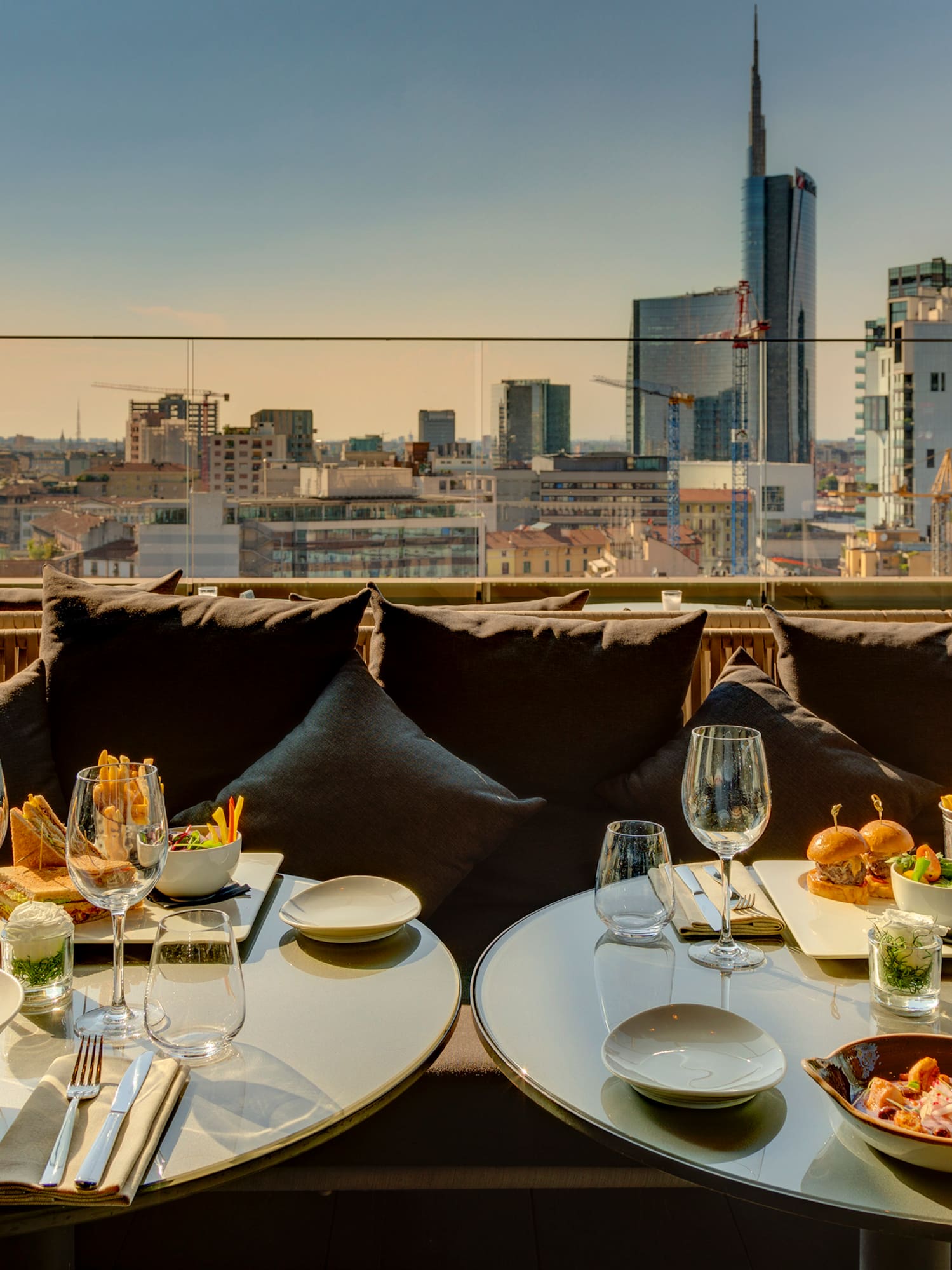 a table with food on it and a city view