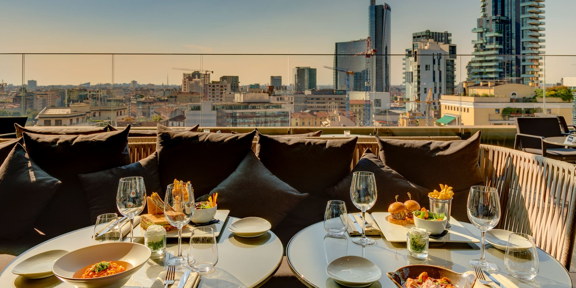 a table with food on it and a city view