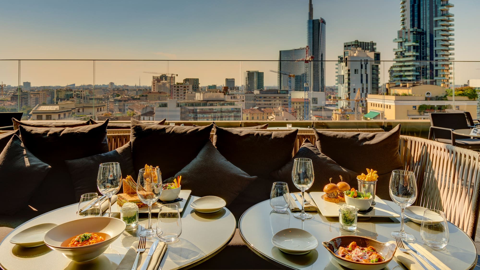 a table with food on it and a city view
