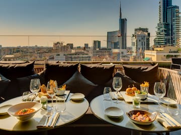 a table with food on it and a city view