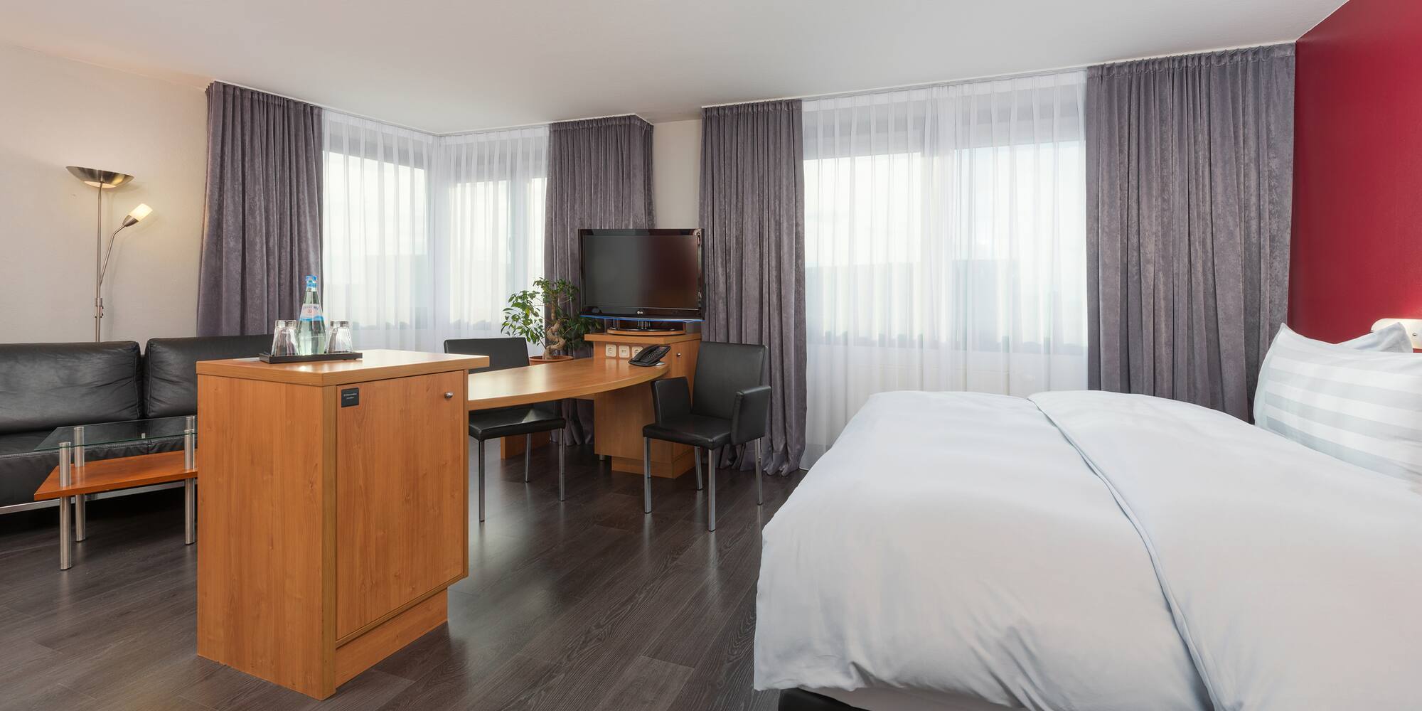 a room with a bed and a desk