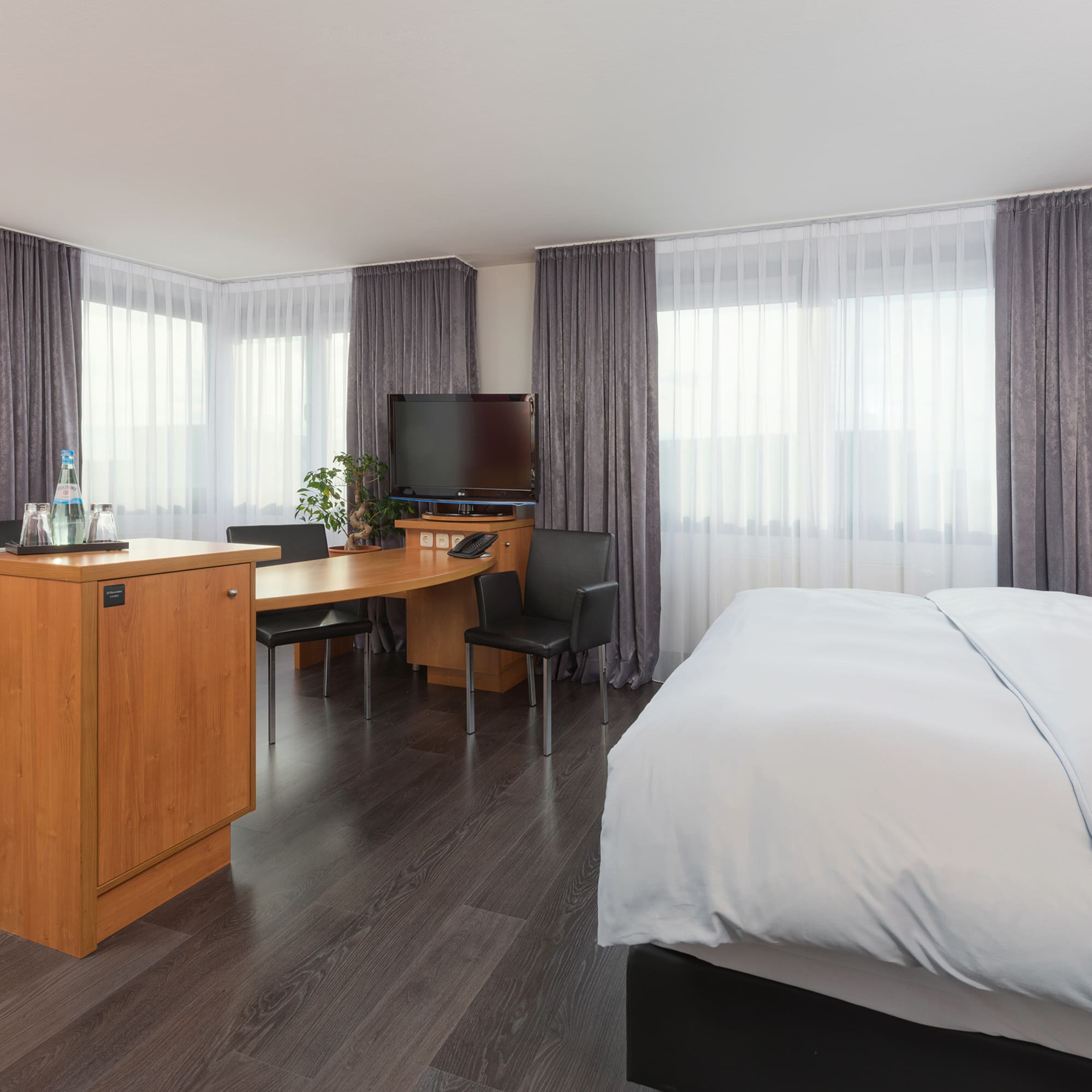 a room with a bed and a desk