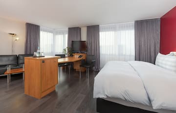 a room with a bed and a desk