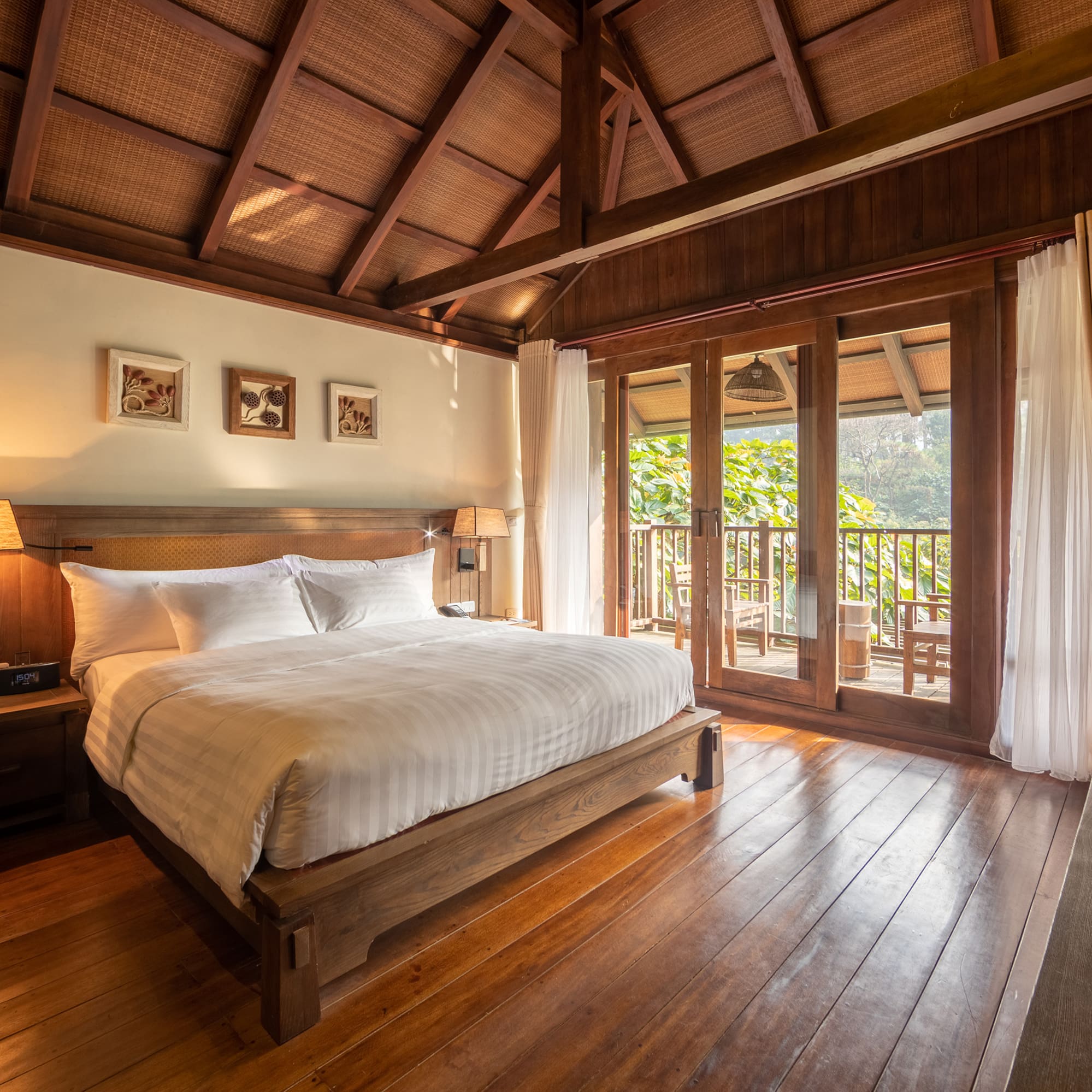 a bedroom with a wood floor and a wooden floor