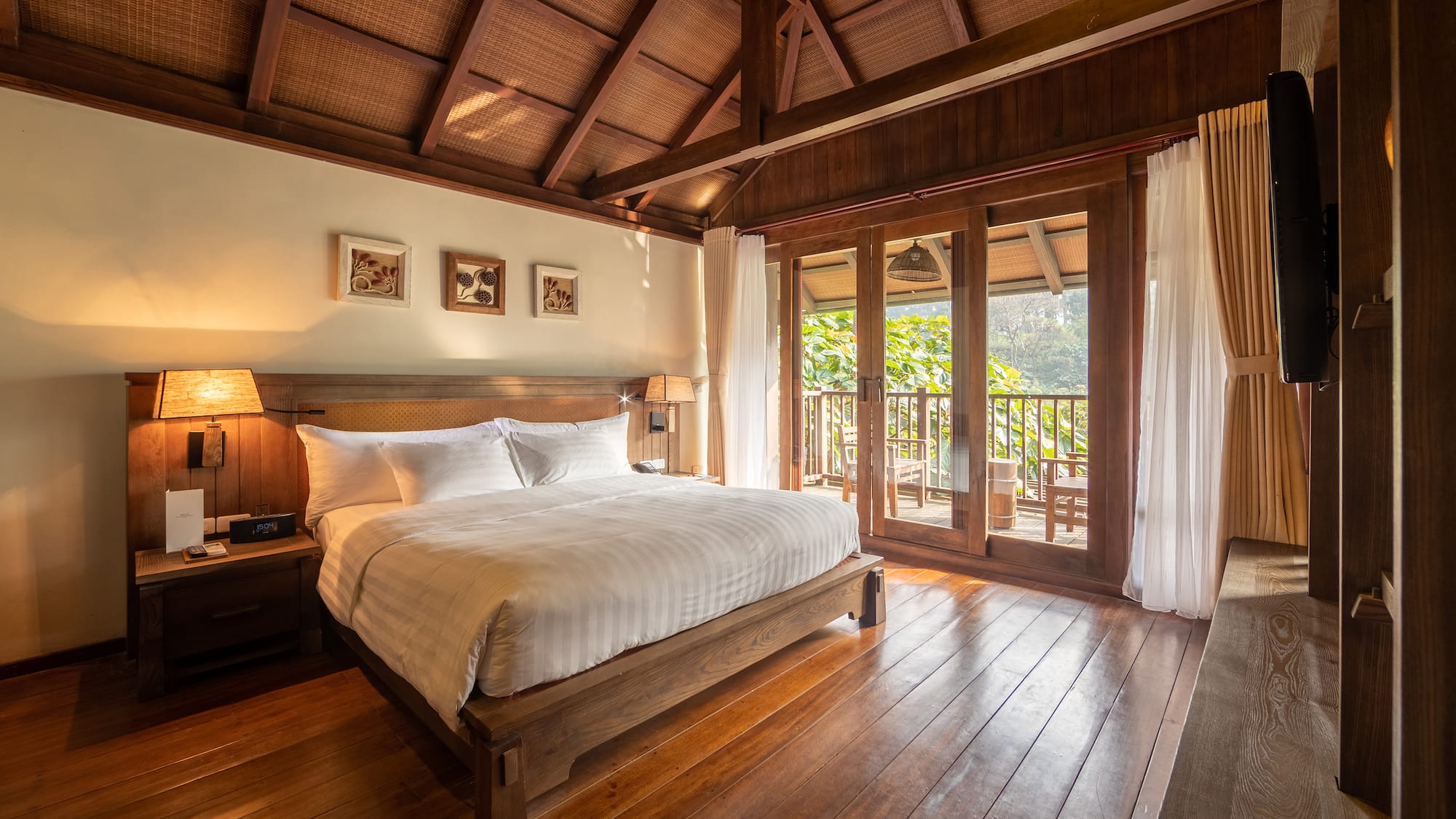 a bedroom with a wood floor and a wooden floor