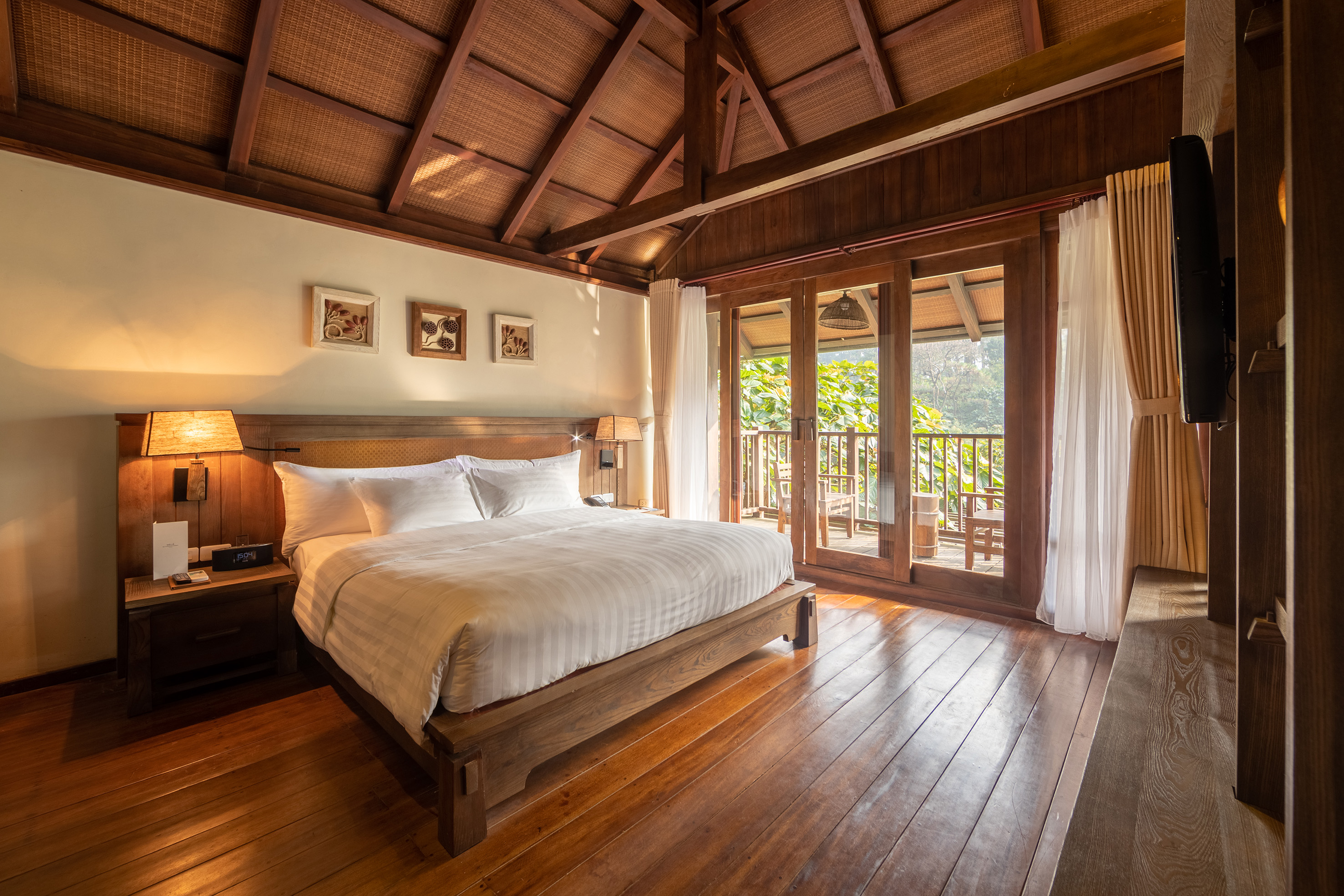 a bedroom with a wood floor and a wooden floor