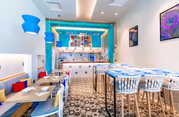 a room with tables and chairs