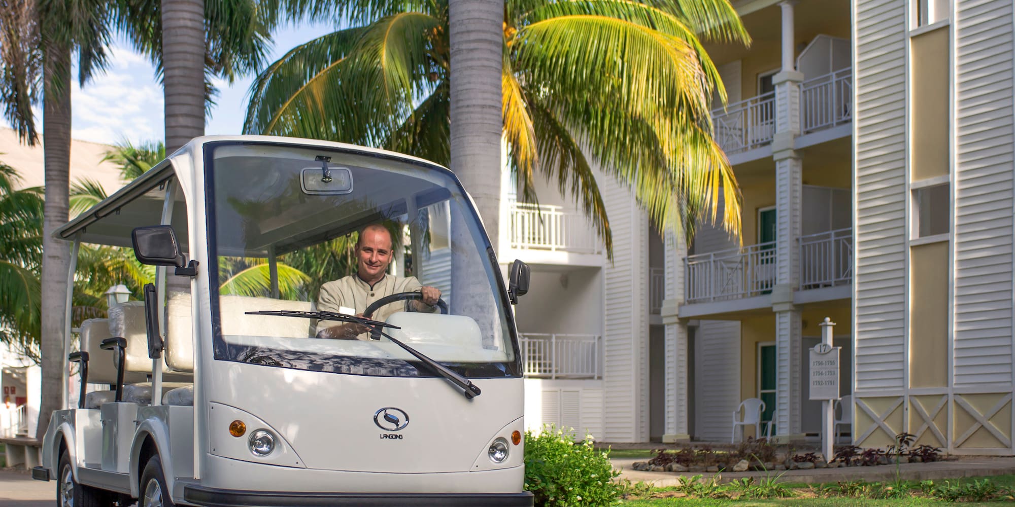a man driving a small vehicle