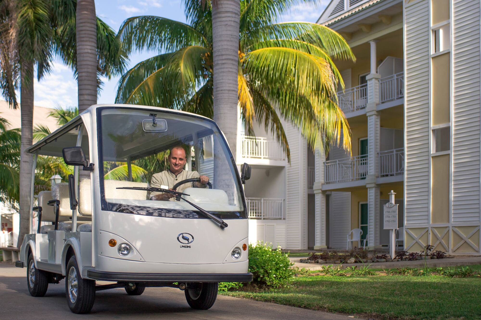 a man driving a small vehicle