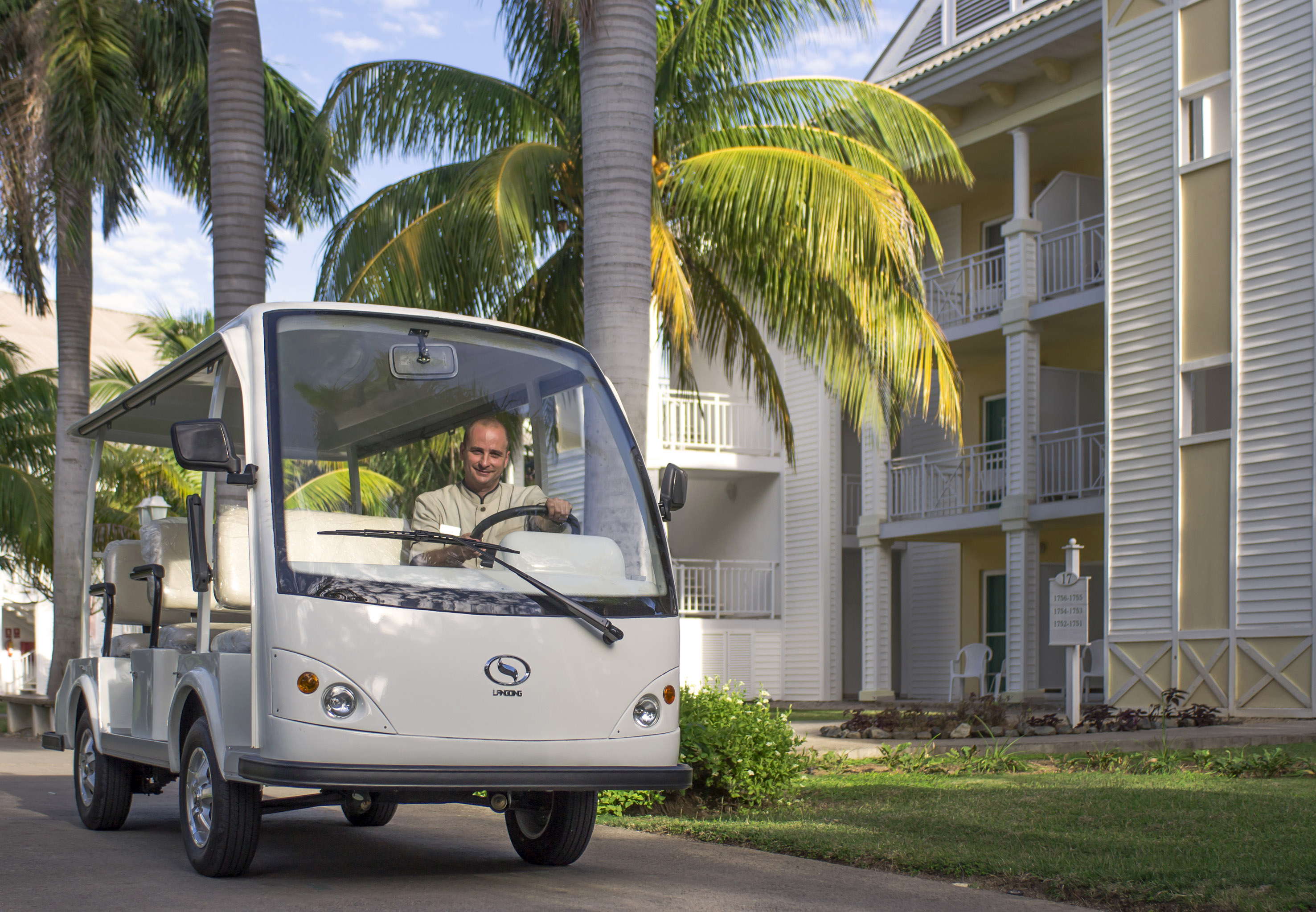 a man driving a small vehicle