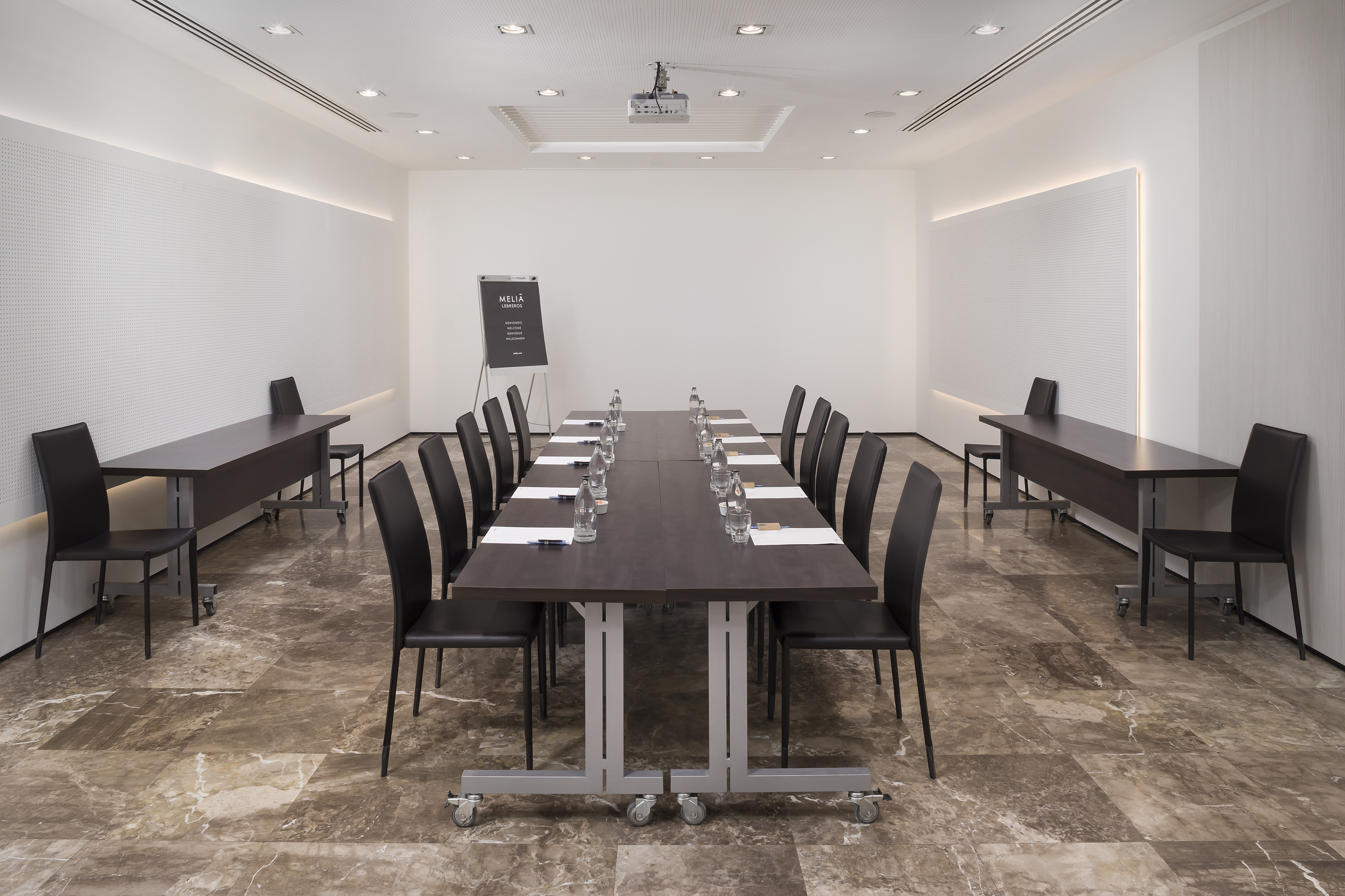 a room with a table and chairs