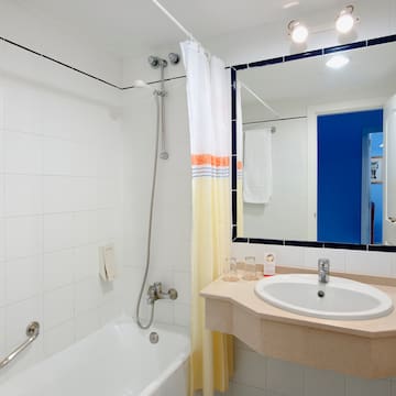 a bathroom with a sink and bathtub