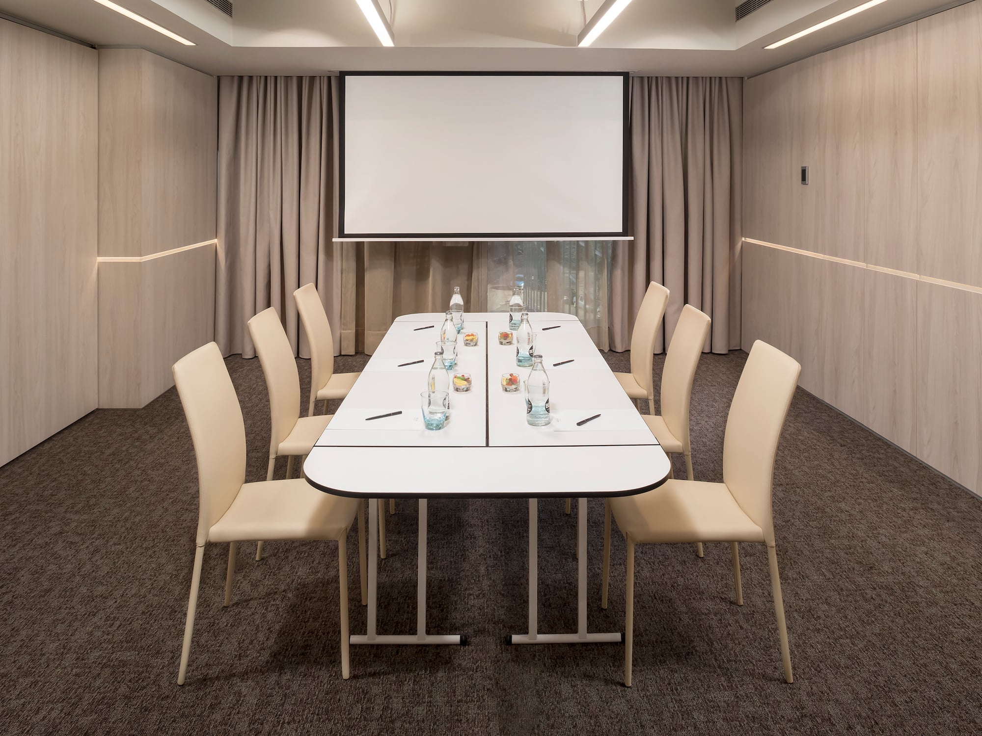 a room with a table and chairs