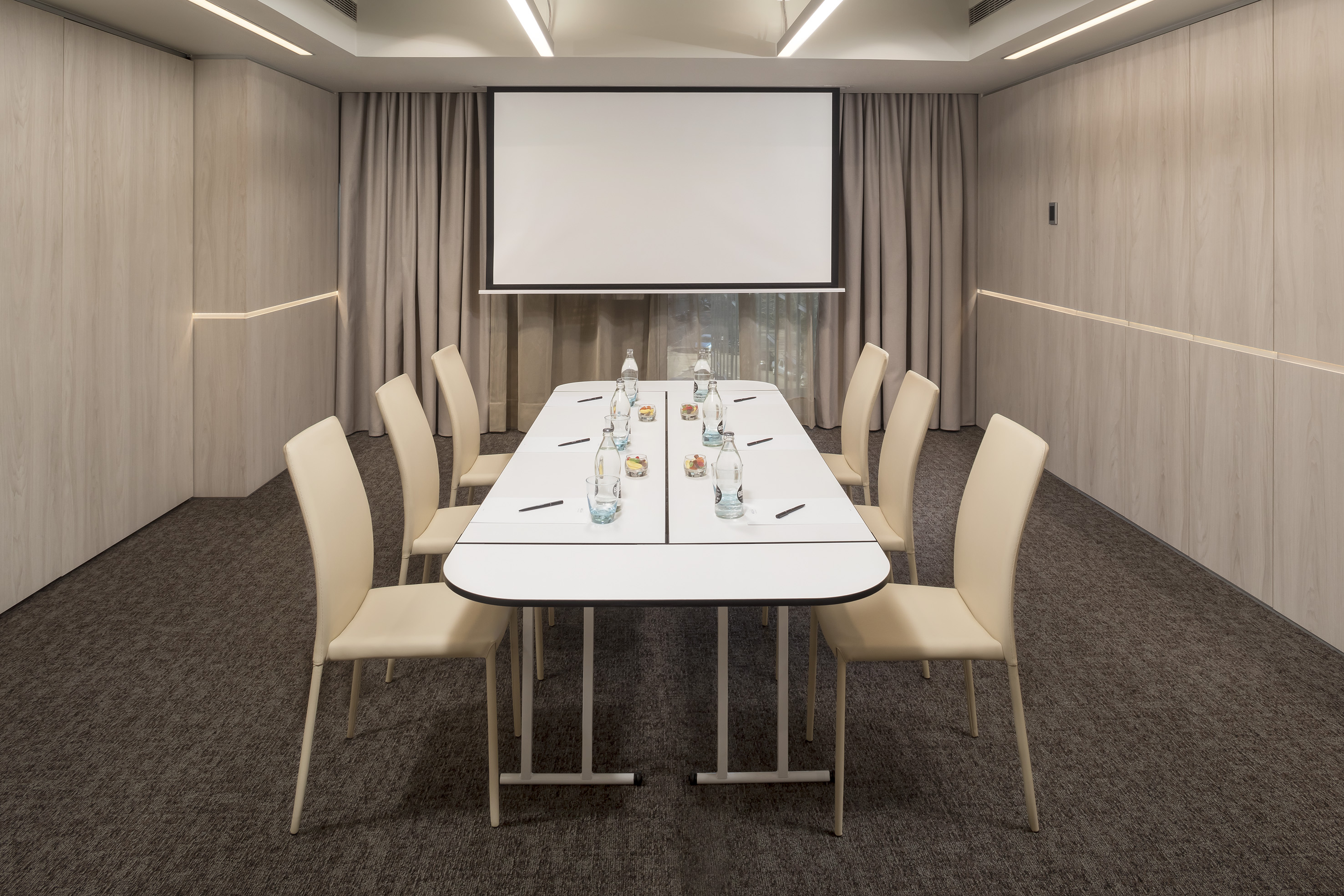 a room with a table and chairs