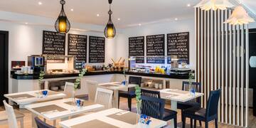 a restaurant with tables and chairs