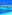 Stunning blue and turquoise ocean with wooden piers and a white catamaran.