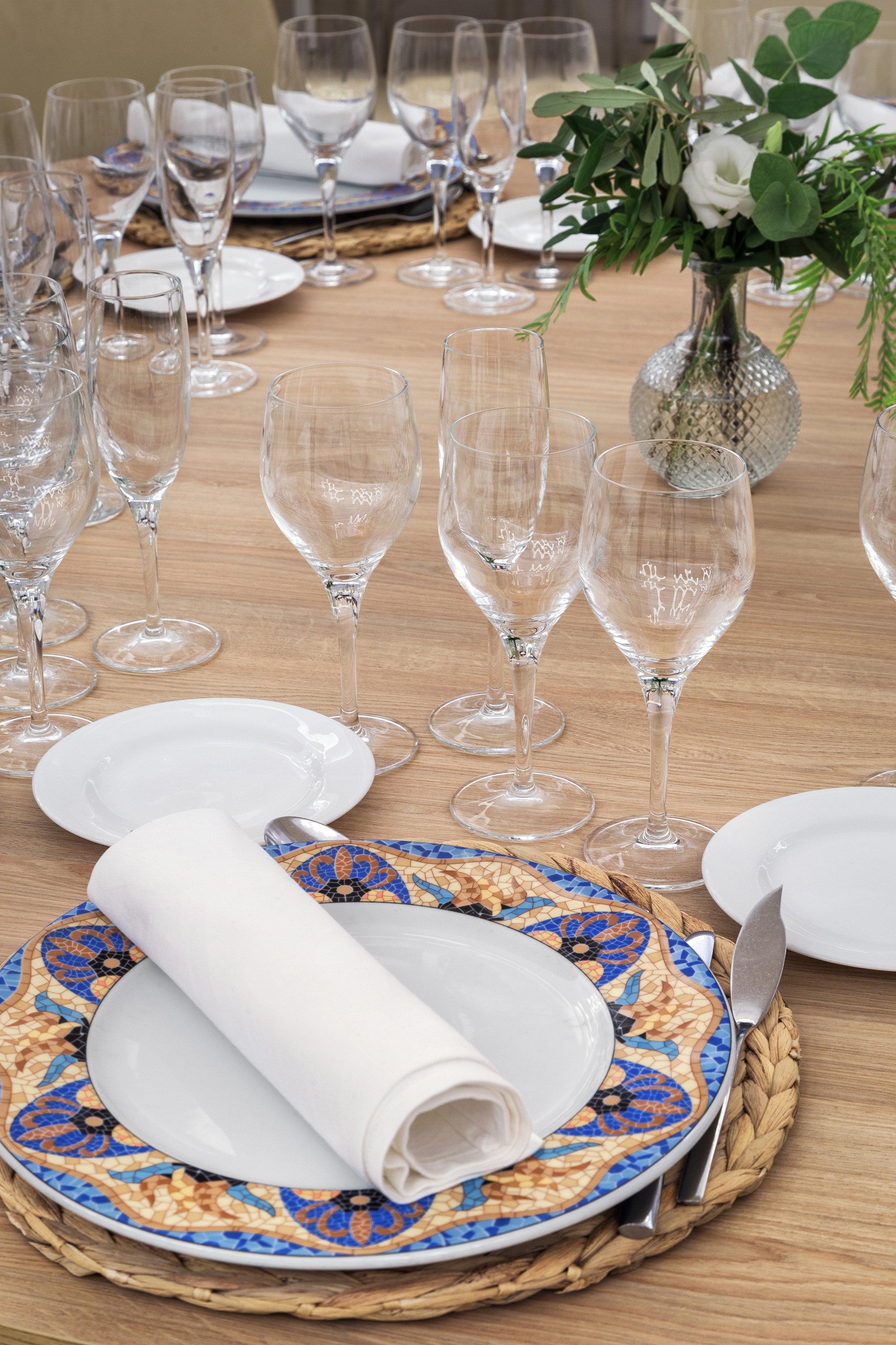 a table with plates and glasses