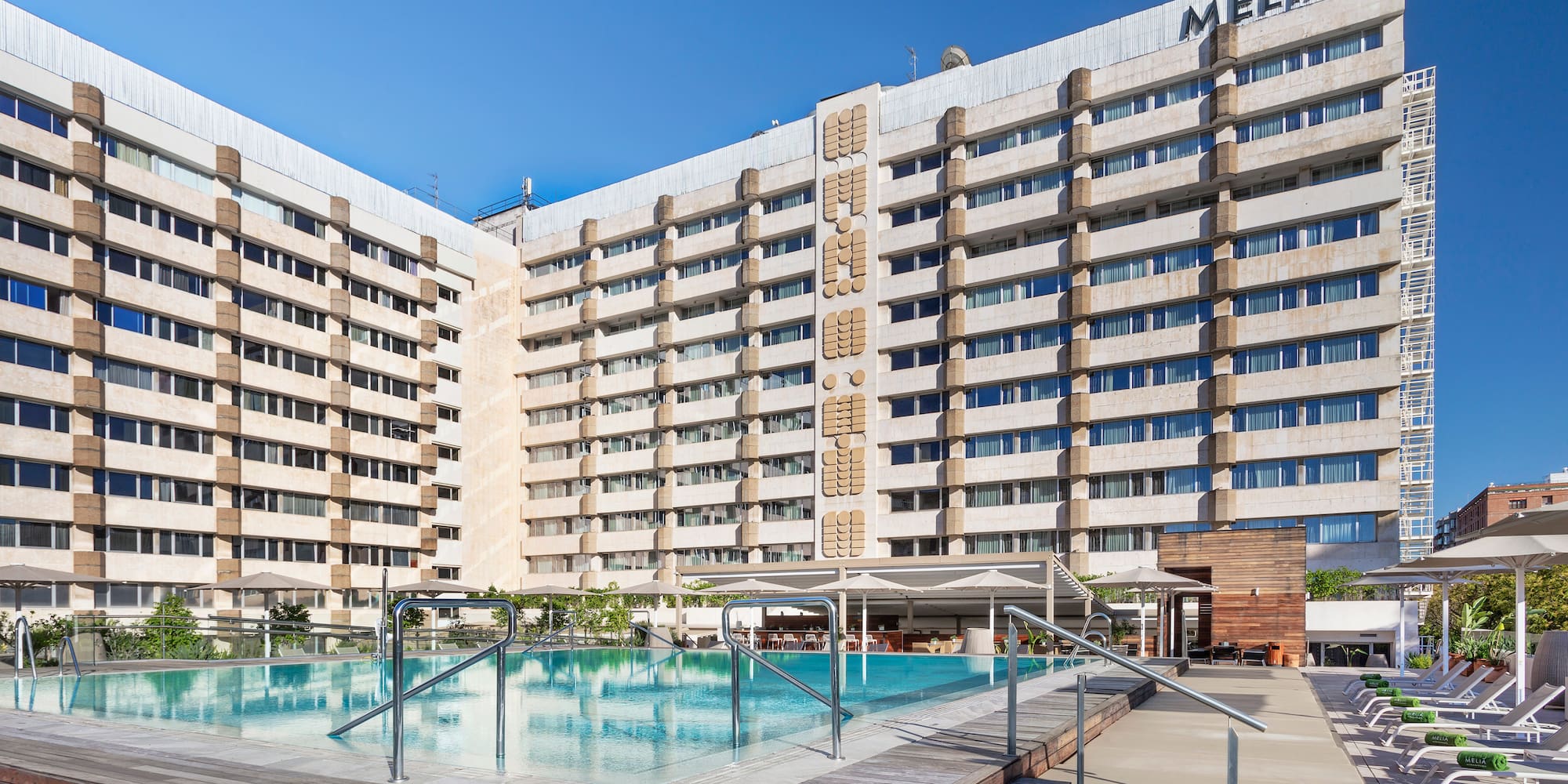 a large building with a pool