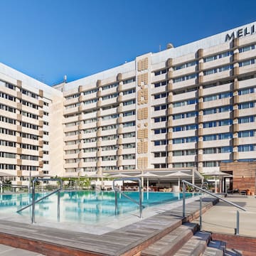 a large building with a pool