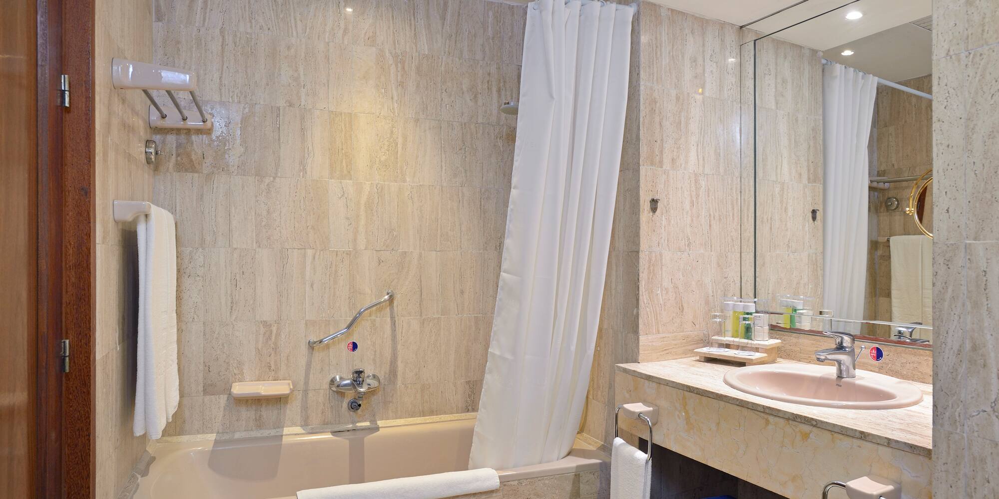 a bathroom with a bathtub and sink