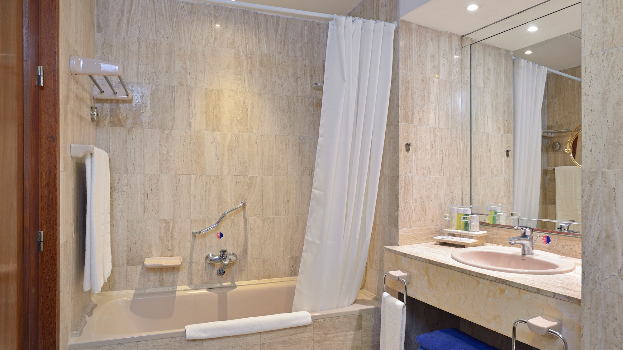 a bathroom with a bathtub and sink