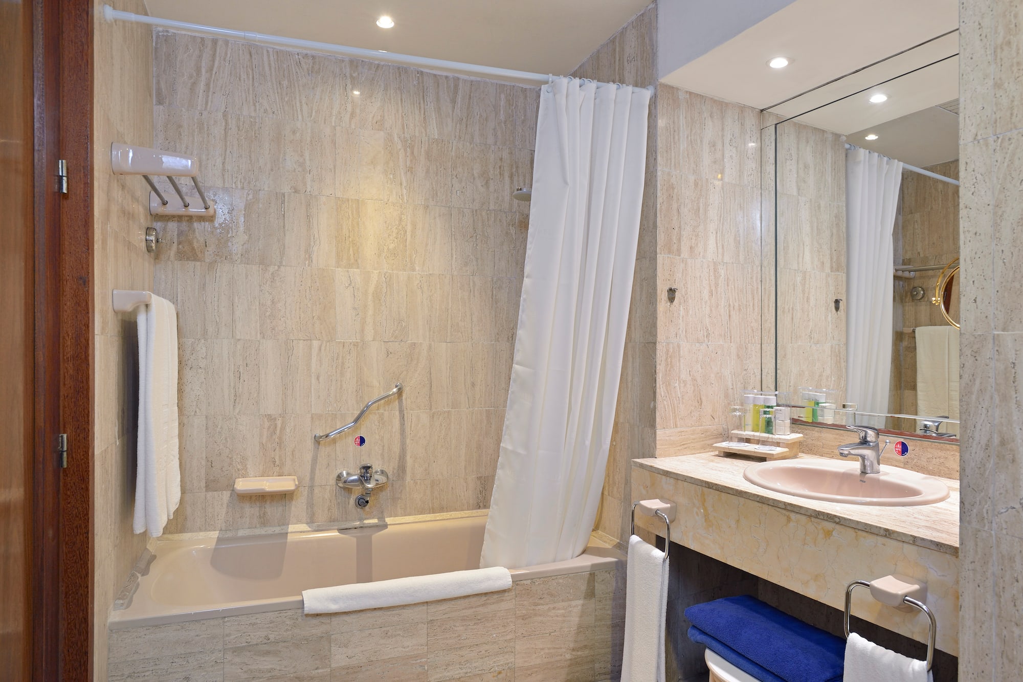 a bathroom with a bathtub and sink