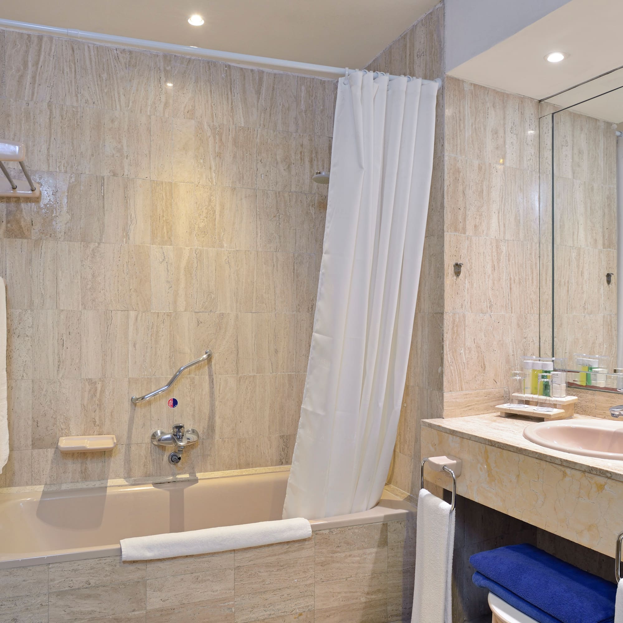 a bathroom with a bathtub and sink