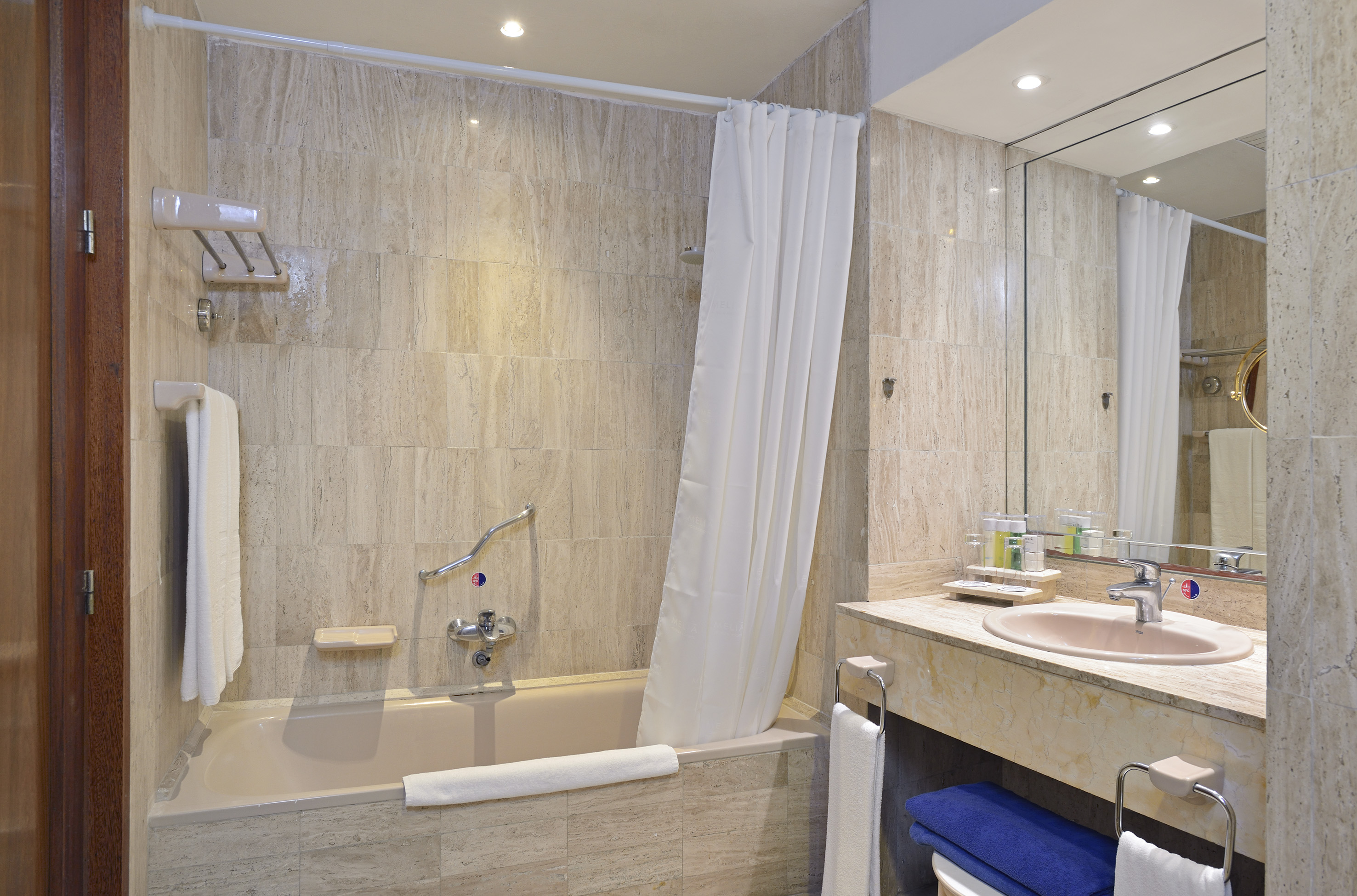 a bathroom with a bathtub and sink