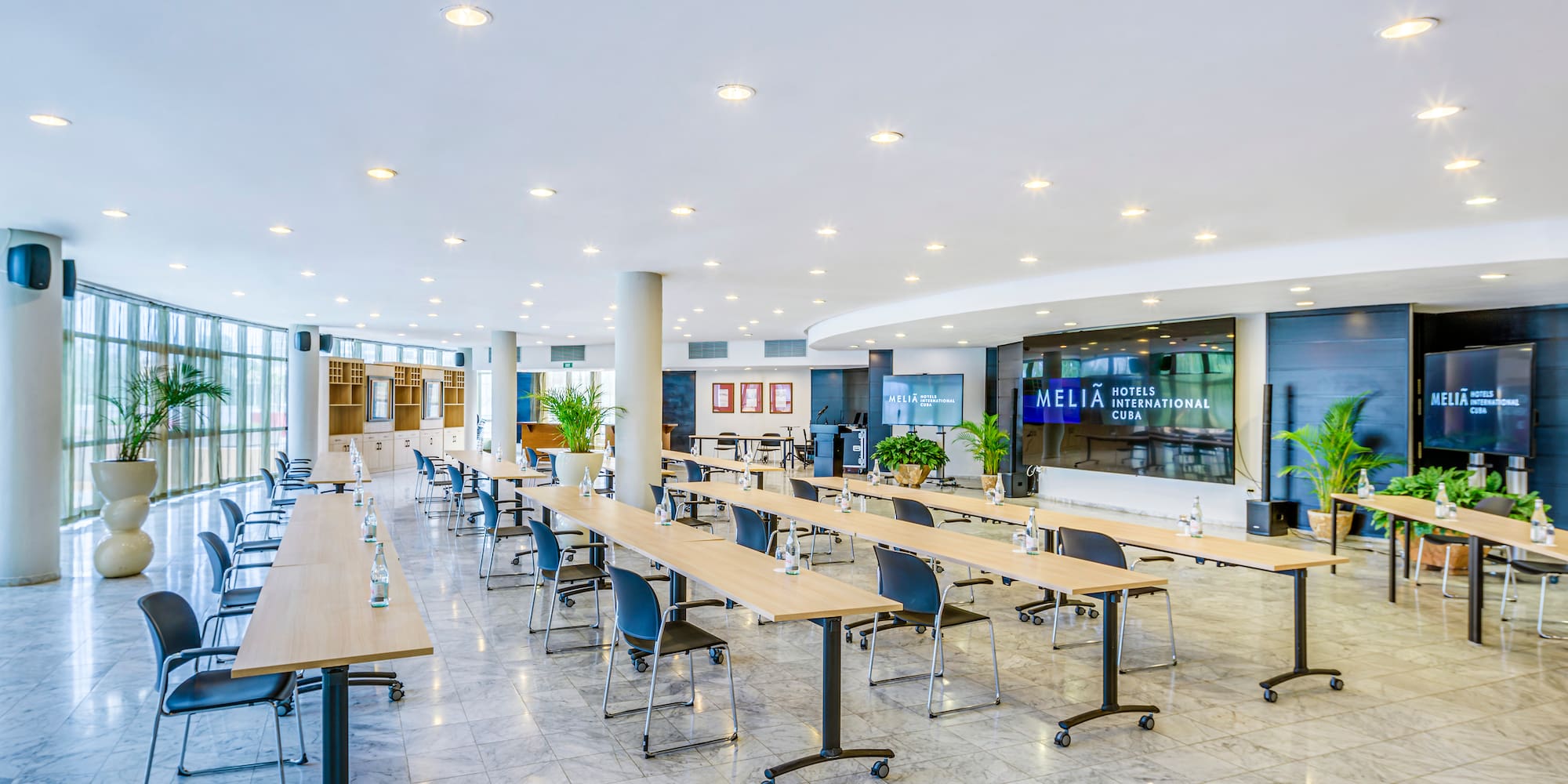 a large room with tables and chairs