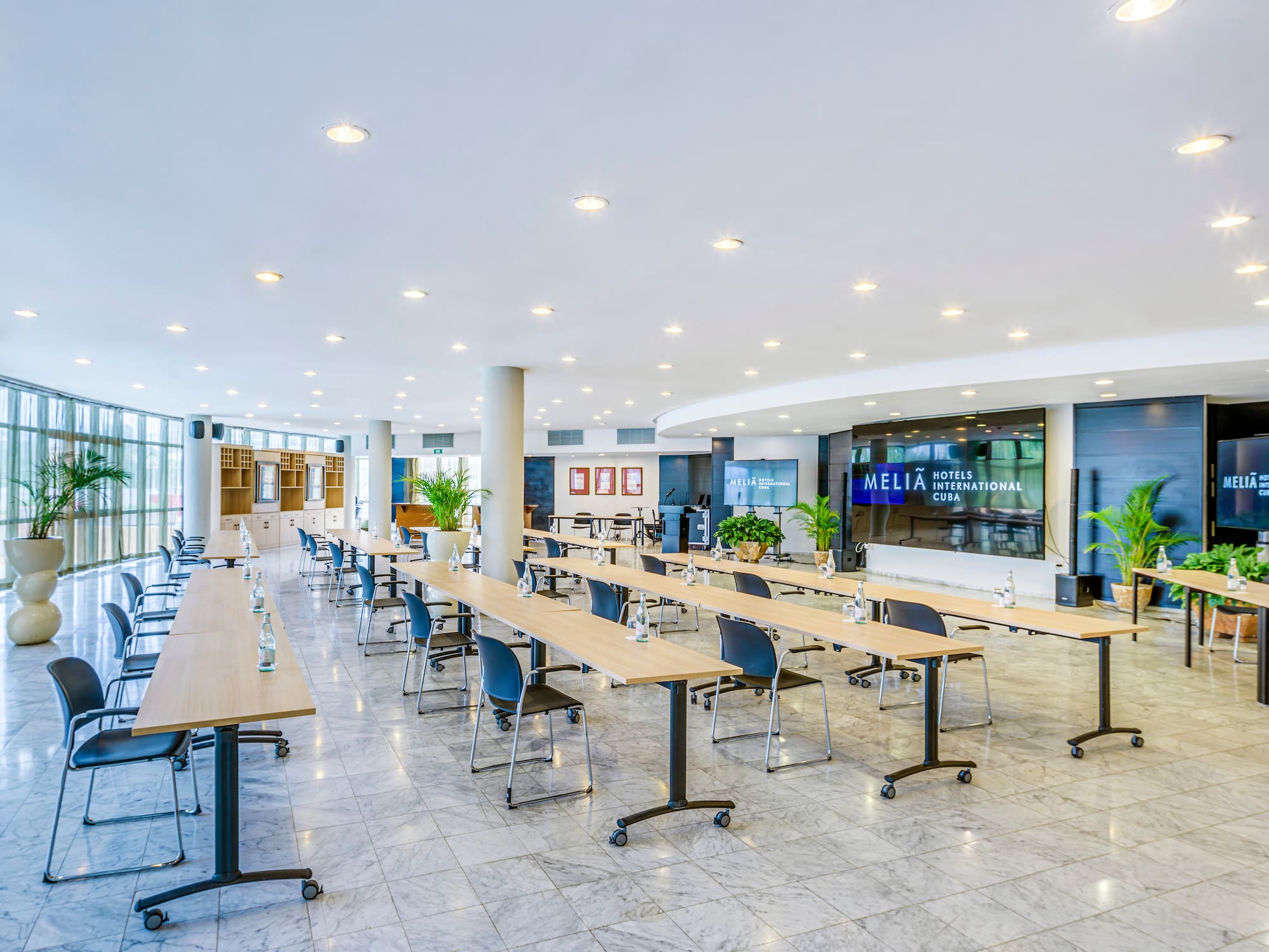 a large room with tables and chairs