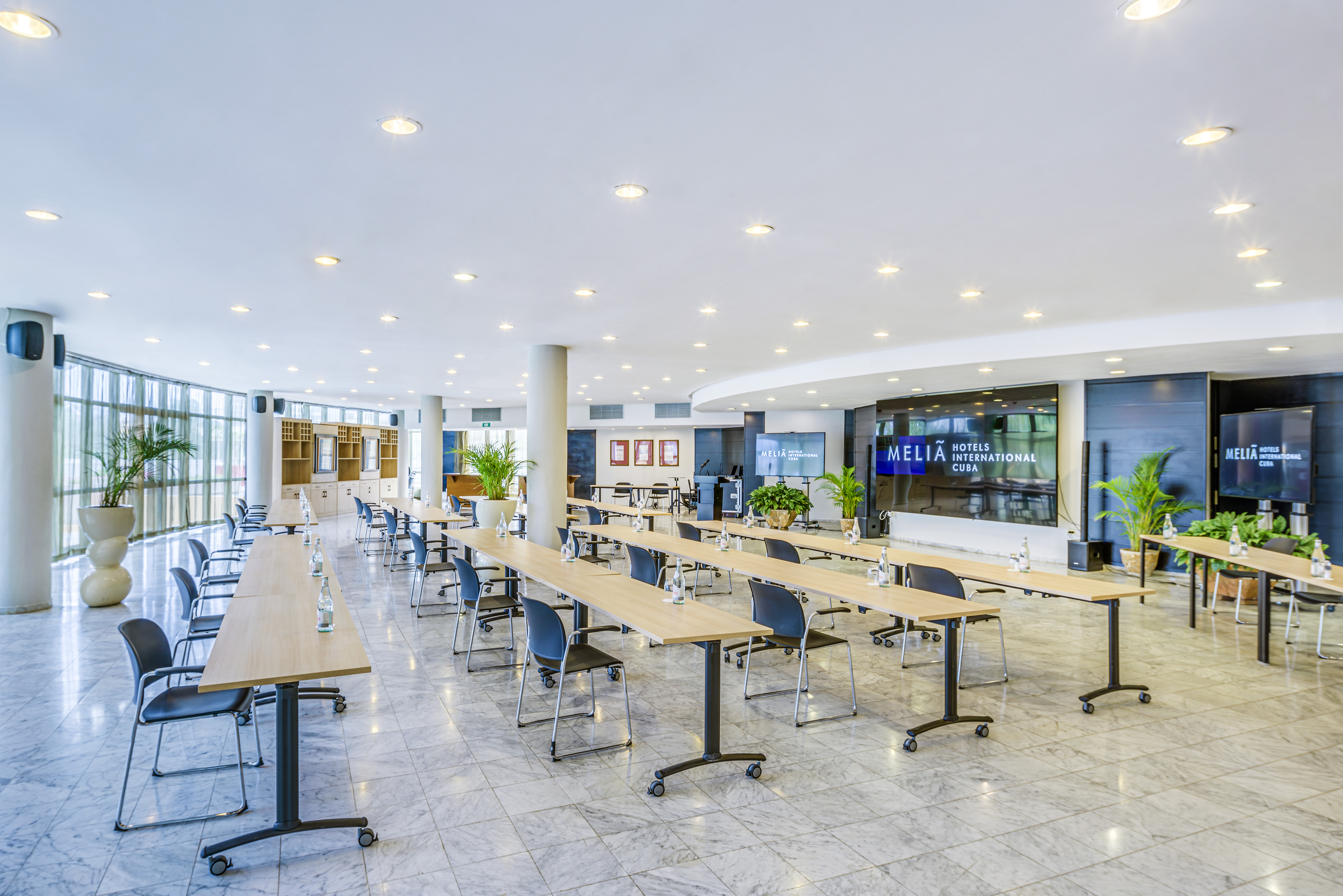 a large room with tables and chairs