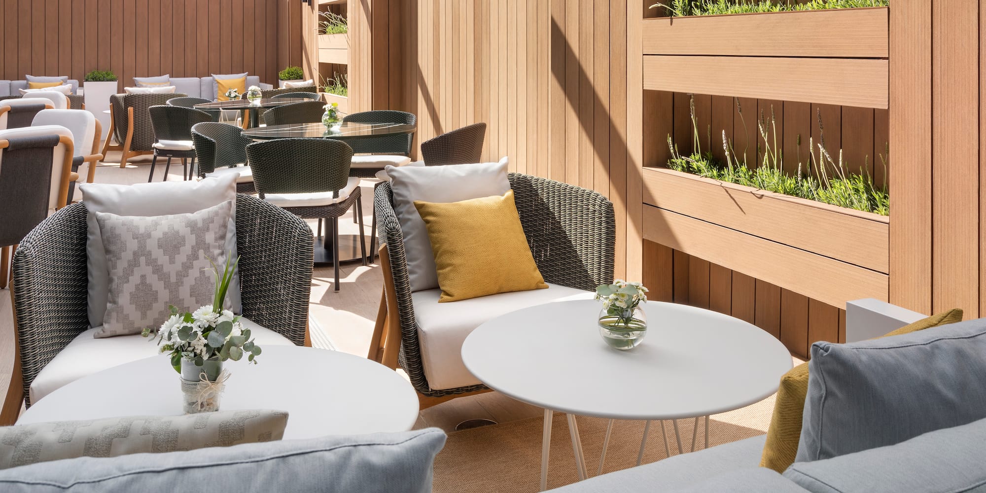 a patio with chairs and tables