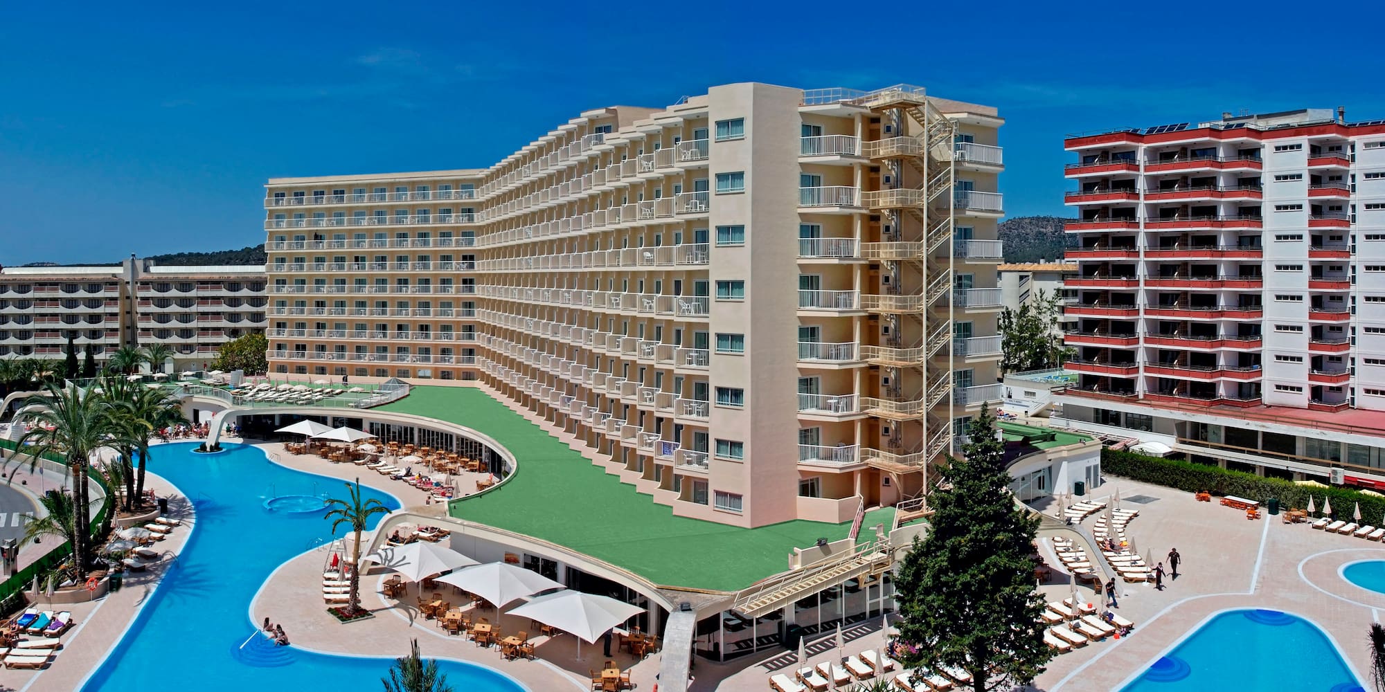 a large building with a pool and a deck