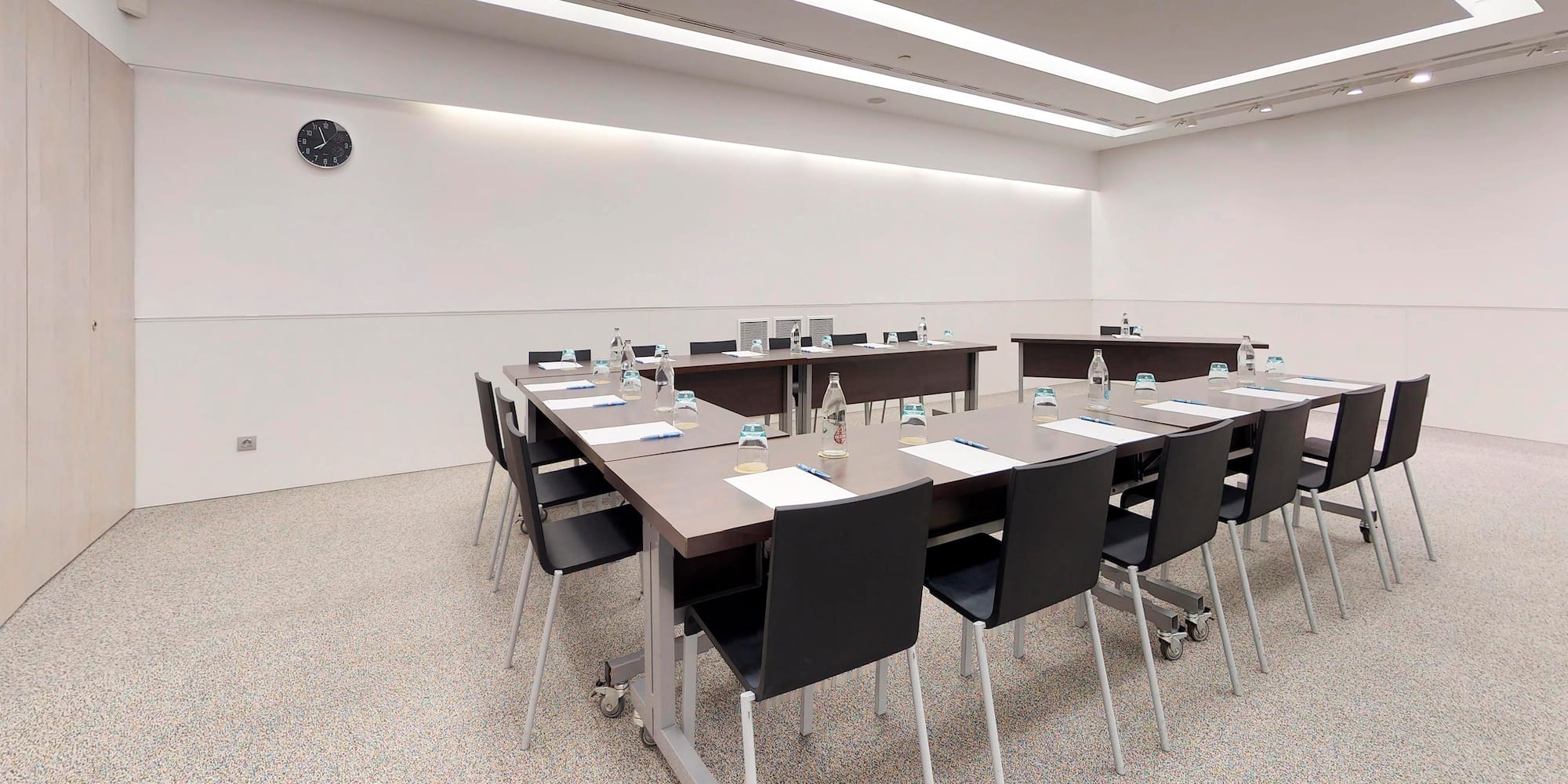 a room with a table and chairs