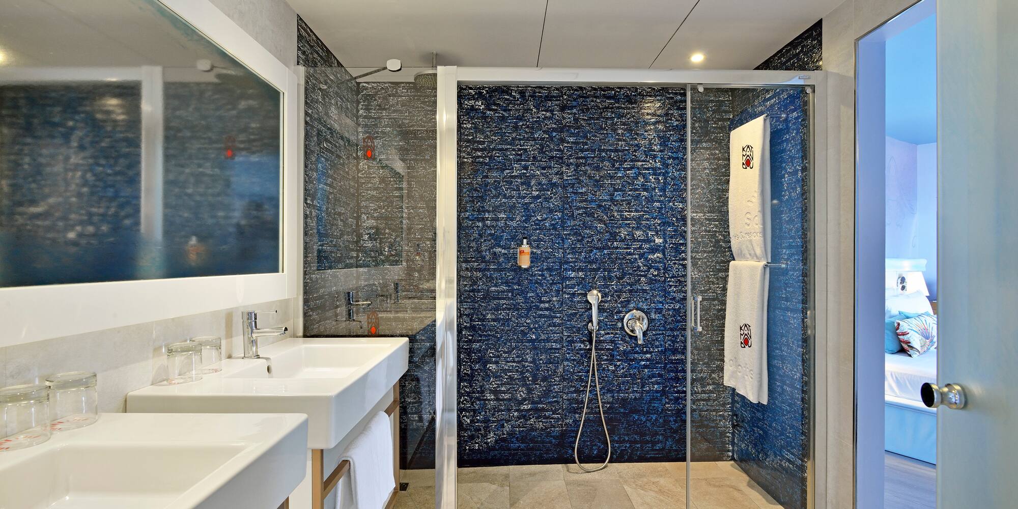 a bathroom with a shower and sink