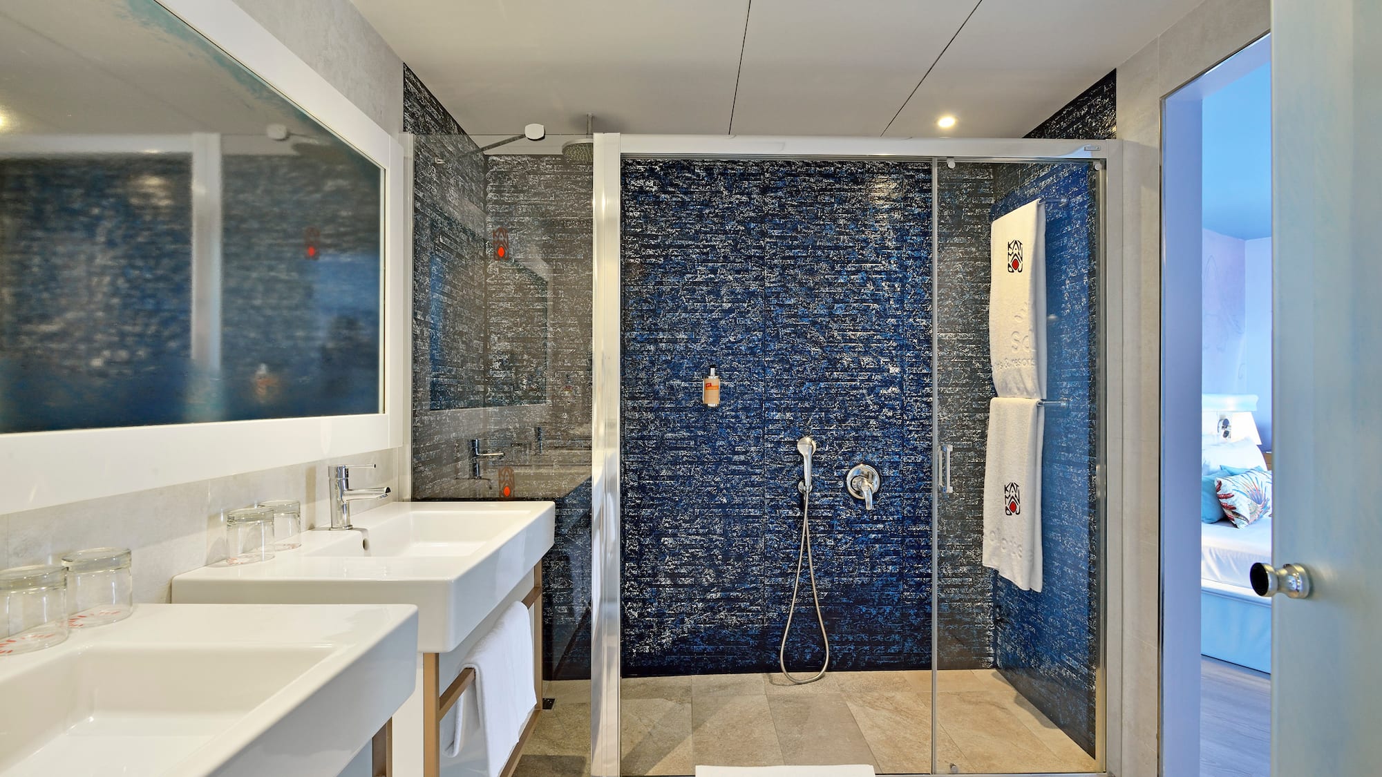 a bathroom with a shower and sink