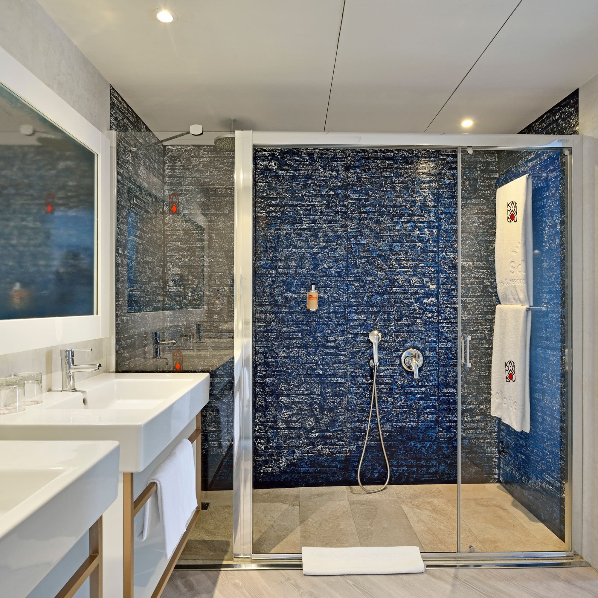 a bathroom with a shower and sink