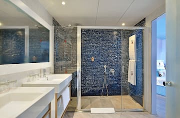 a bathroom with a shower and sink