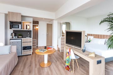 a room with a tv and a table