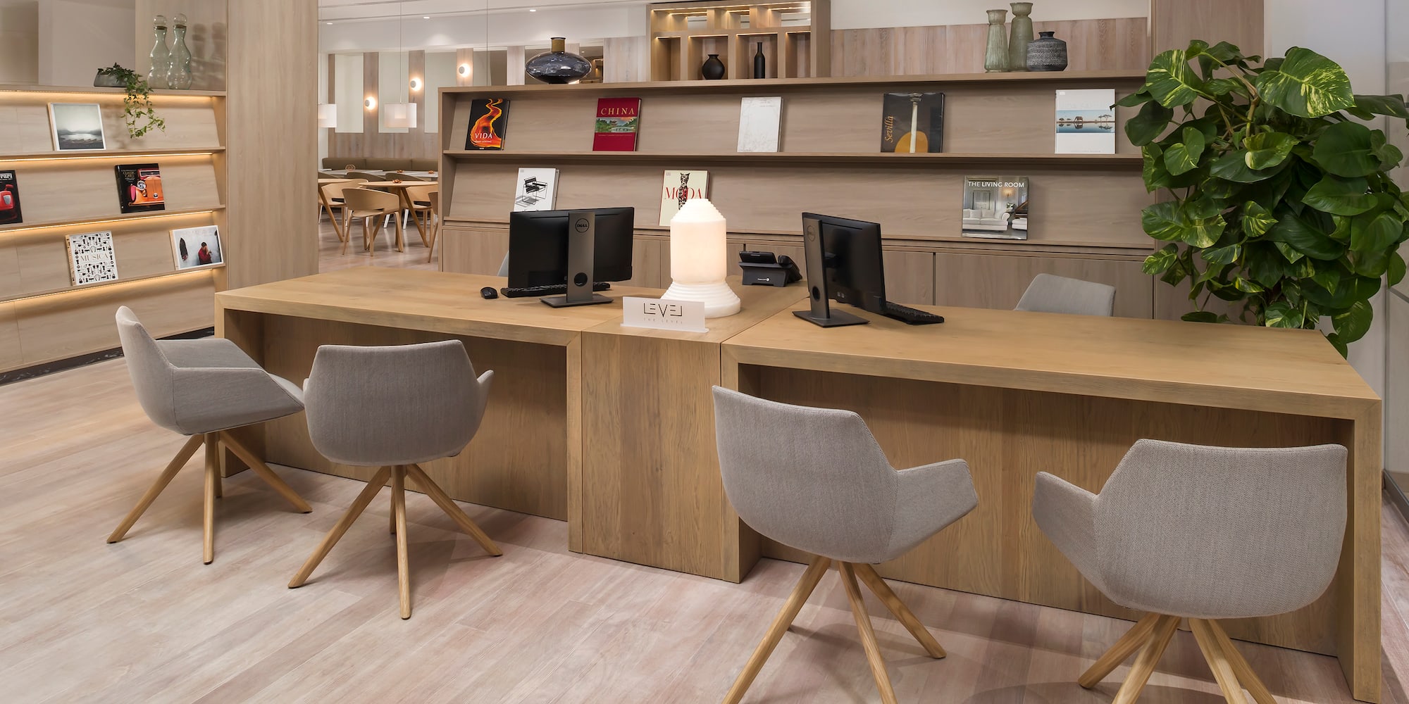 a room with a desk and chairs