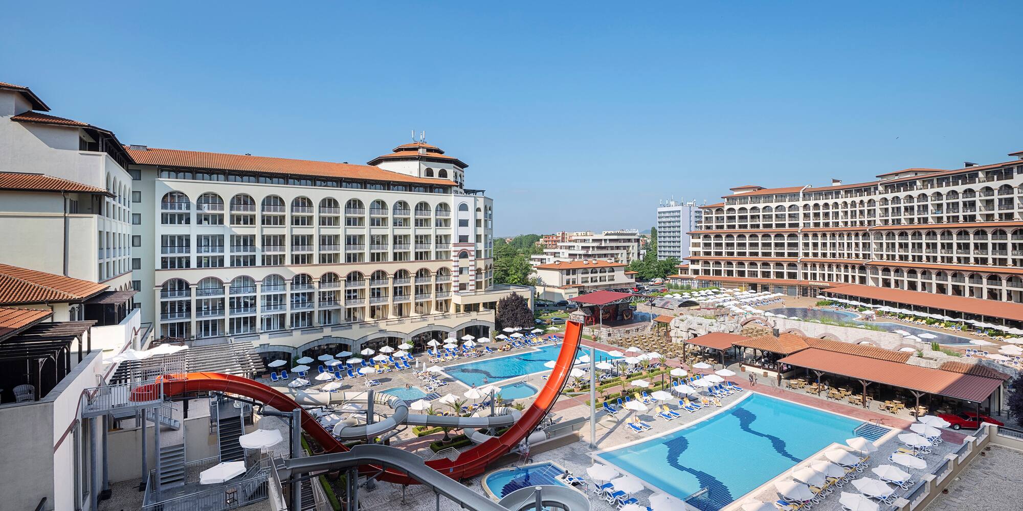 a water slide and a pool in a hotel