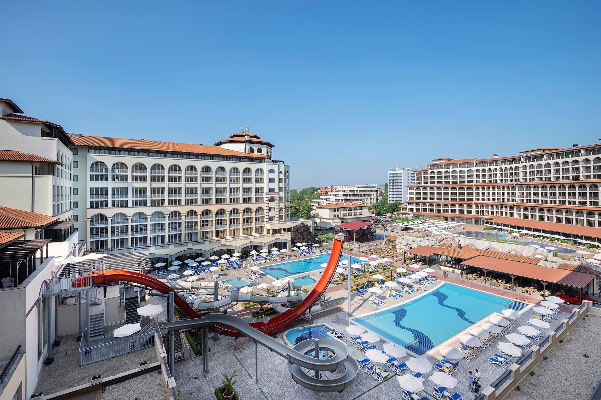 a water slide and a pool in a hotel