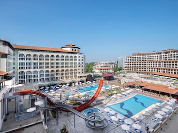 a water slide and a pool in a hotel