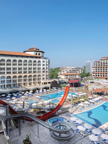 a water slide and a pool in a hotel
