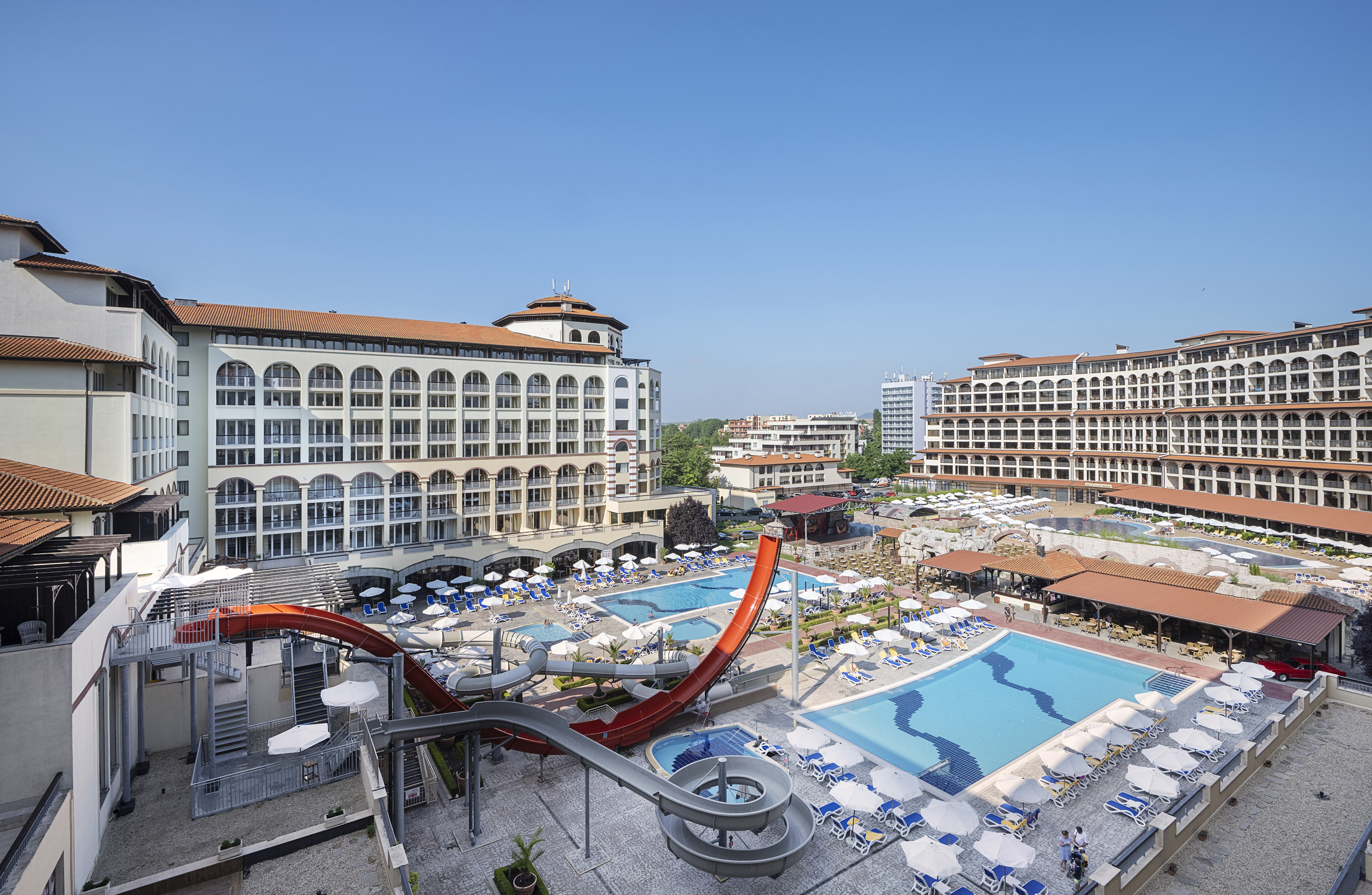 a water slide and a pool in a hotel