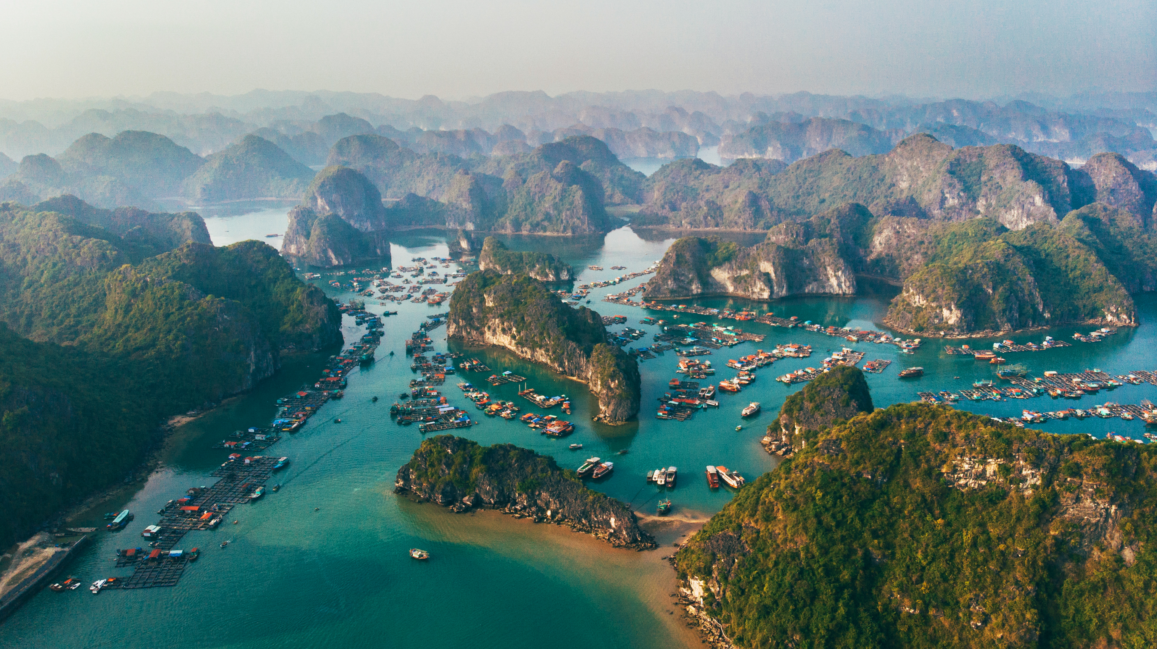 boats in the water with islands