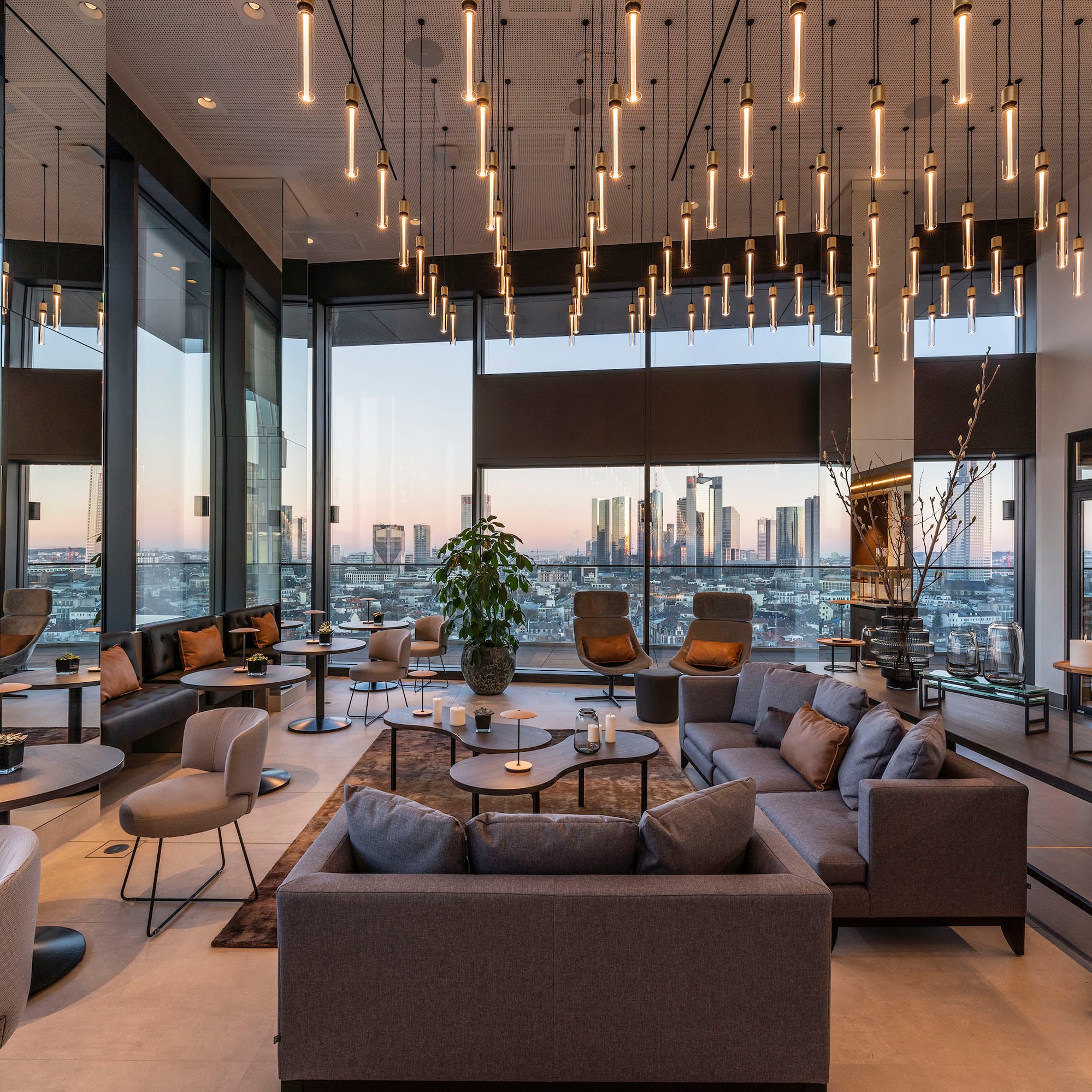 a room with a large window and a large city view