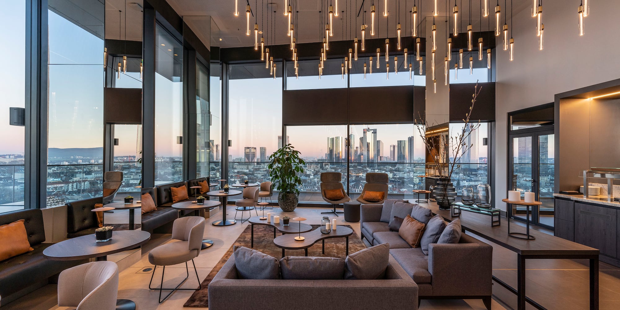 a room with a large window and a large city view